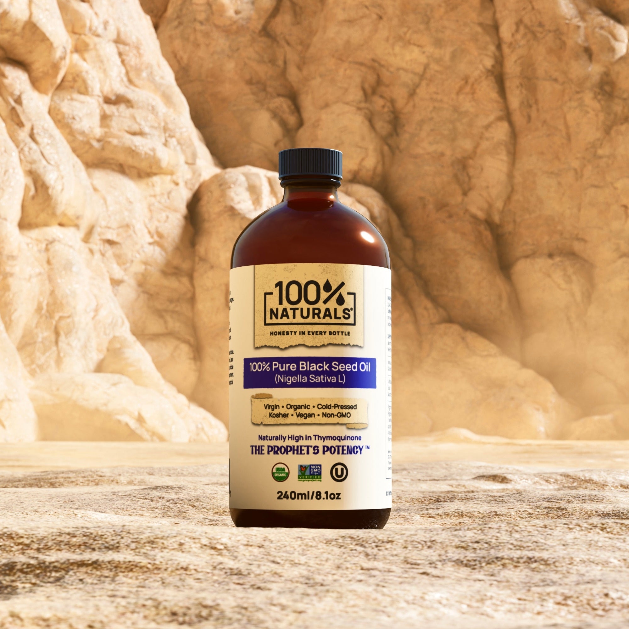 Bottle of 100% Naturals oil in front of desert rock formations